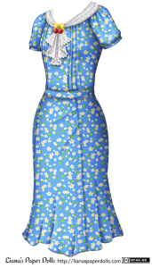 A 1930s-style blue dress with a small pattern of white flowers and green leaves. The neckline is decorated with a white lace scarf pinned with a plastic brooch in the shape of a yellow bow over a pair of red cherries. The scarf falls in a lace-edged ruffle down the front of the dress. The sleeves are slightly puffed, and there are rows of pintucks down the front of the bodice to each side of the ruffle. It's belted at the waist with the same kind of fabric. The skirt is just past knee length and is slightly flared at the base.